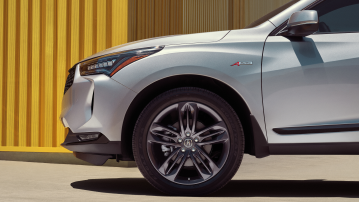 Profile view of front fender of white RDX.